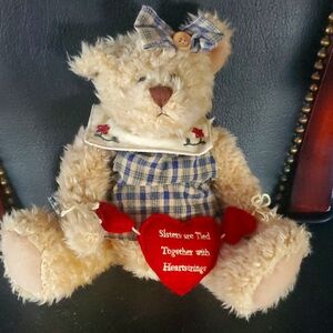 Stuffed bear. Basket or shelf decor would make a great gift for your sister!
